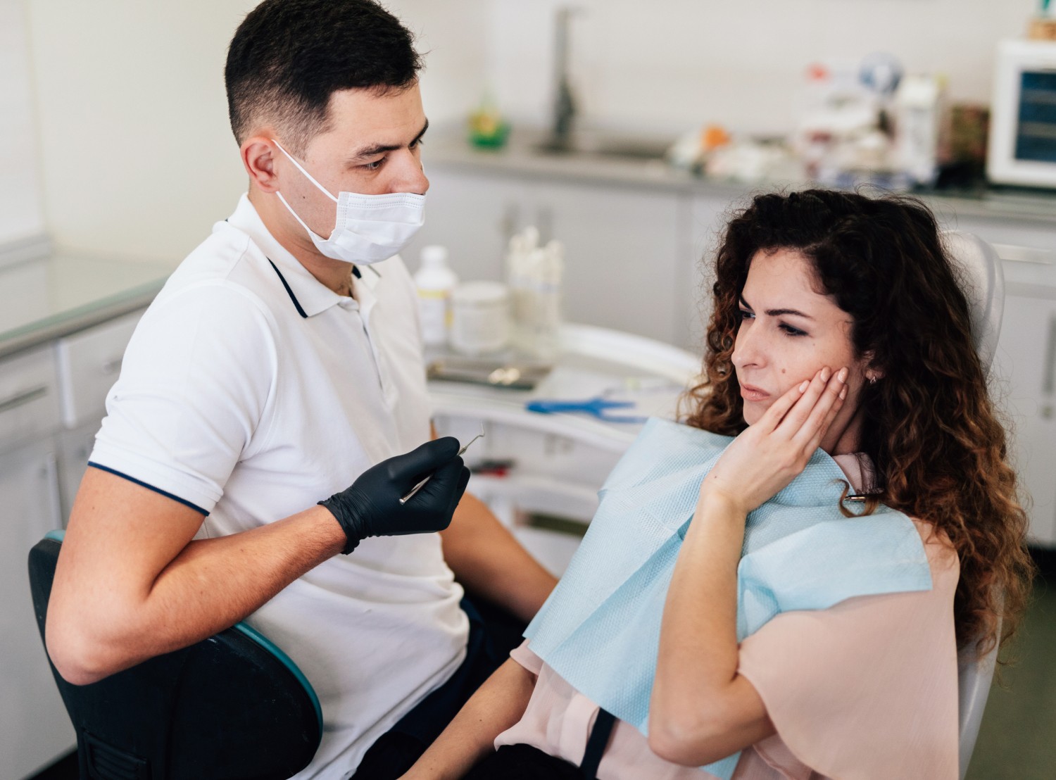 Https://Assets.Tina.Io/C06d8490 A43b 48c0 96ef 818b9b6fe891/Images/Services/Wisdom Tooth Extraction/Woman Showing Hurt Mouth.Jpg